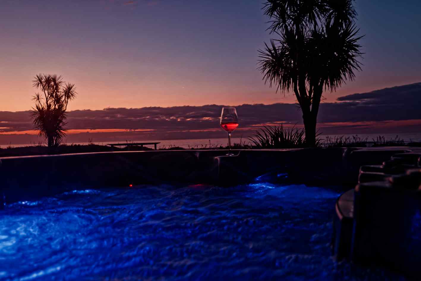 relax in the hot tub, looking out to the Tasman sea